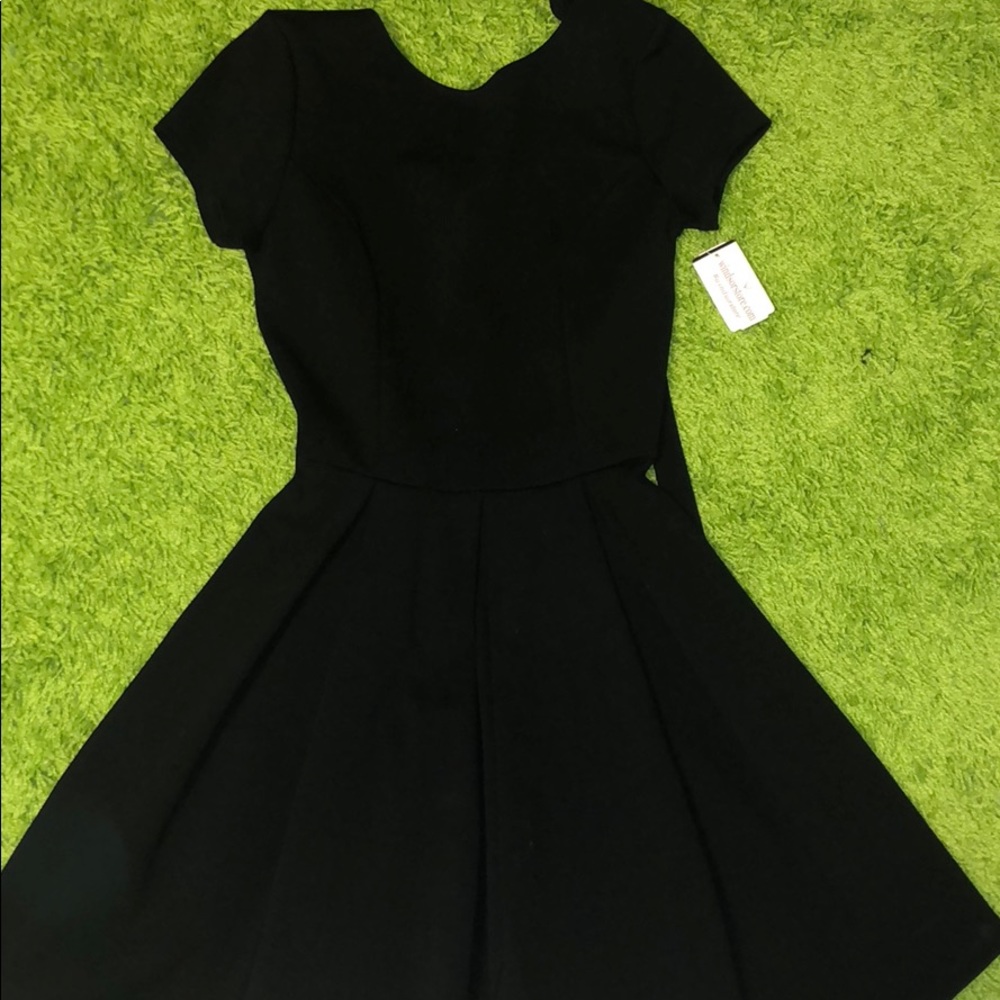 Adorable black dress. Brand new! Size XS